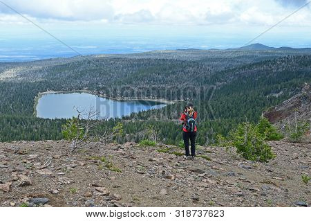 Female Hiker Enjoying The View From The Tam Mcarthur Rim Trail In The Three Sisters Wilderness Near 