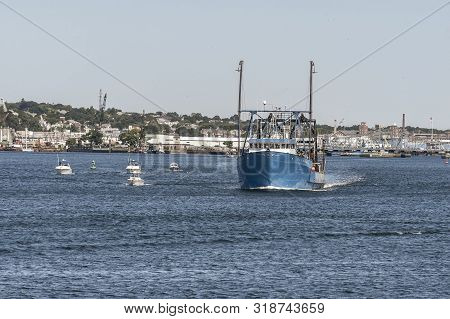New Bedford, Massachusetts, Usa - August 24, 2019: Cluster Of Small Boats Maintain Their Distance Fr
