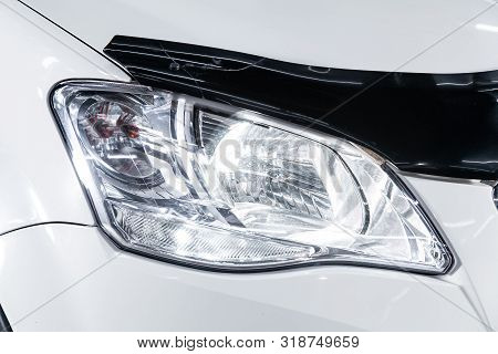 Novosibirsk, Russia - August 01, 2019:   Ssangyong
Actyon, Macro View Of Modern White Car Xenon Lamp