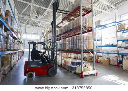 Belarus, The City Of Mensk, April 12, 2019. Chemical Production.worker On A Loader In A Warehouse
