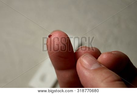 Close Up Of Woman Hands Using Lancet On Finger To Check Hiv Status. Hiv Test Express.