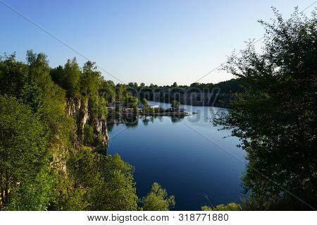 Lake Among The Rocky Mountains, Turquoise Clear Water, Wild Nature, The Suns Reflection In Water, Re