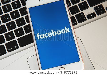 Palo Alto/ Usa - August 08 2009: White Iphone With Logo Of Social Media Facebook On The Screen. Soci