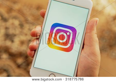 Palo Alto / Usa - August 08 2019: Female Hand With Apple Phone With Logo Of Social Media Instagram O