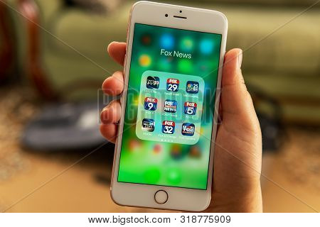Palo Alto / Usa - August 08 2019: Female Hand Holding White Apple Iphone With Icons Of Different Fox