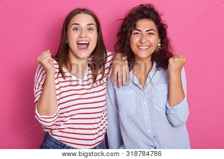 Portrait Of Young Women Wearing Casual Clothes Standing And Looking Camera, Fameles Keeping Mouth Op