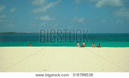 Tropical Beach With Tourists And Clear Blue Sea. Summer And Travel Vacation Concept. Daco, Philippin