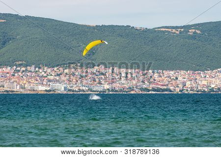 Sunny Beach, Bulgaria July 13, 2019. The Man Practices Hydrofoil Kitesurfing In The Black Sea Off Th