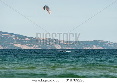 Sunny Beach, Bulgaria July 13, 2019. The Man Practices Hydrofoil Kitesurfing In The Black Sea Off Th