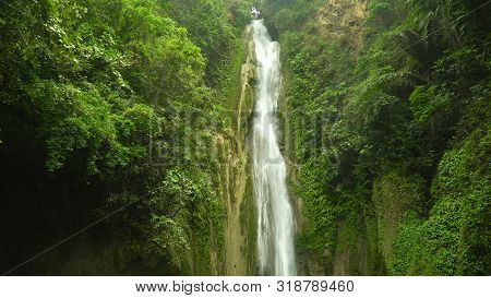 Mantayupan Falls In The Jungle, Island Of Cebu, Philippines. Waterfall In The Green Forest.