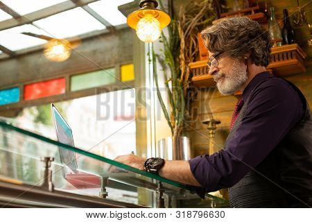 Serious Adult Man Being Absorbed In Work.