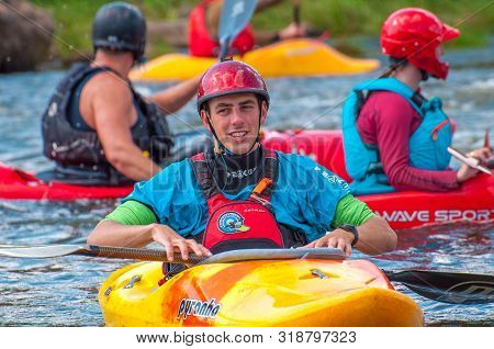 Myhiya, Ukraine - August 17, 2019: Playboating. A Company Of Young Freestyle Kayakers. A Short Break