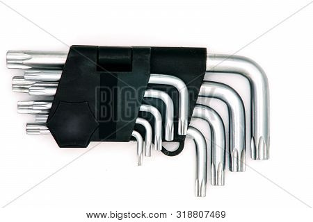 Star-shaped Crimping Wrench Set On A White Background. Star Kit Tool Or Allen Wrench Set. Tool For M