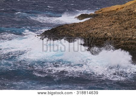 Huge Waves Crash On Cloudy Day. Kemmuna Island