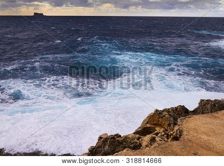 Huge Waves Crash On Cloudy Day. Kemmuna Island