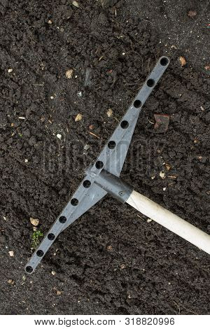 Loosening The Excavated Ground With A Rake Close-up