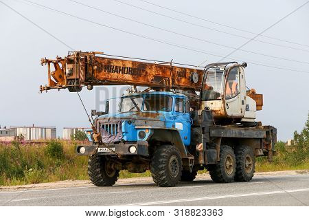 Novyy Urengoy, Russia - July 30, 2019: Old Construction Crane Ural 4320 At The Interurban Road.