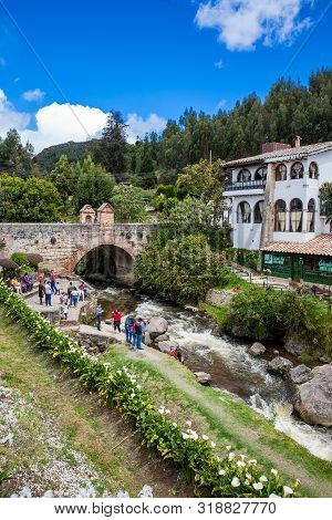 Mongui, Colombia - August, 2019: Tourists Visiting The Royal Bridge Of Calicanto At The Beautiful Sm