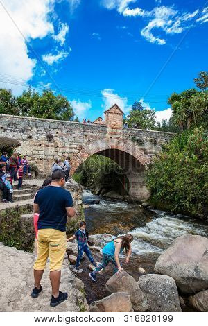 Mongui, Colombia - August, 2019: Tourists Visiting The Royal Bridge Of Calicanto At The Beautiful Sm