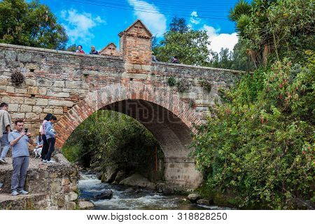 Mongui, Colombia - August, 2019: Tourists Visiting The Royal Bridge Of Calicanto At The Beautiful Sm