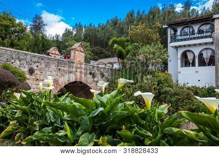 Mongui, Colombia - August, 2019: Tourists Visiting The Royal Bridge Of Calicanto At The Beautiful Sm
