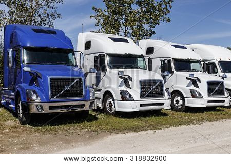 Zionsville - Circa August 2019: Volvo Semi Tractor Trailer Trucks Lined Up For Sale. Volvo Is One Of