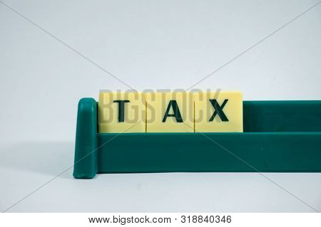 Tax Word Concept Light Background Image Using By Block Letter For Various Purposes Of Tax Return Or 