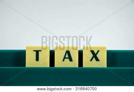 Tax Word Concept Light Background Image Using By Block Letter For Various Purposes Of Tax Return Or 