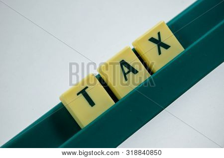 Tax Word Concept Light Background Image Using By Block Letter For Various Purposes Of Tax Return Or 