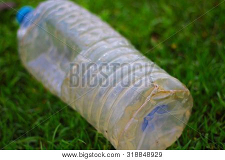 Plastic Pollution - Plastic Bottle Is Fallen Down In The Grass