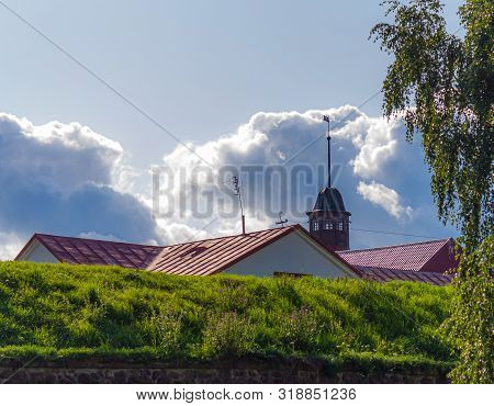 Korela Fortress. The Spire Of The Fortified Watchtower With A Weather Vane And The Roof Of The Barra