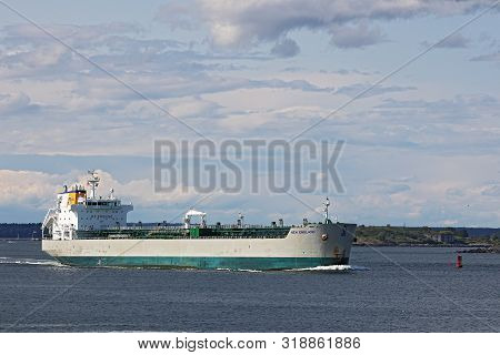 Portland, Maine - August 10, 2019: View Of Danforth Cove And A Big Cargo Ship From Fort Williams Par