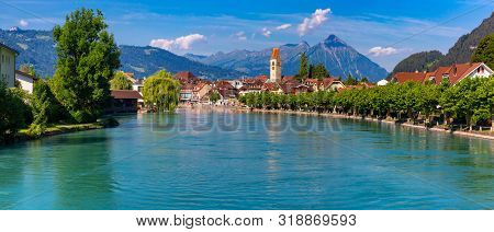 Panoramic View Of Old City Of Unterseen With Church And Aare River, Interlaken, Important Tourist Ce