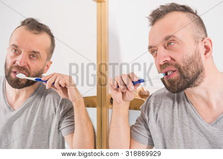 Funnny Guy Taking Care Of His Oral Hygiene, Brushing Teeth During Morning Bathroom Routine.