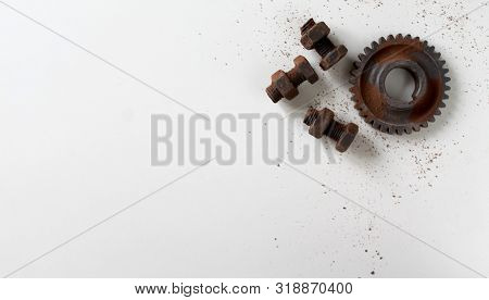 Rusty Bolts, Nuts And Gear Wheel Made Of Chocolate Isolated On White Background. Chocolate Chip Scat