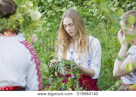 Belarus, The City Of Gomel, July 07, 2018. Holiday Kupala. Girls Weave A Wreath For The Kupala Night