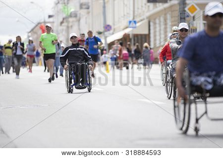 Belarus, The City Of Gimel, July 03, 2019. Youth Festival.wheelchair Race.a Man In A Wheelchair Comp