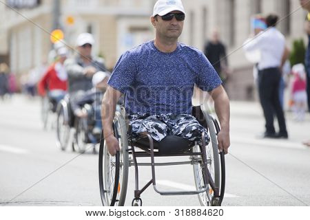 Belarus, The City Of Gimel, July 03, 2019. Youth Festival.wheelchair Race.a Man In A Wheelchair Comp