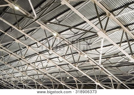 Metal Trusses Covering An Industrial Long-span Building With Indoors Floodlights