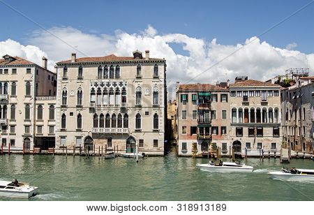 Venice, Italy - May 16, 2019:  View On A Sunny Spring Day Across The Grand Canal Of Venice Looking T