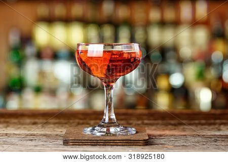 Cocktail Aperitif Based On Rum. Drinks Garnished With Orange. Space For Text