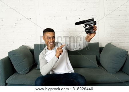 Young Happy Blogger Recording Video On Camera For Internet Blog