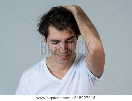 Close Up Portrait Of Young Sensitive Man Feeling In Love Looking Happy, Shy And Lucky. Isolated On N