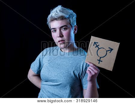 Good Looking Happy And Proud Trans Teenager Holding The Symbol Of The Transgender Drawn On A Cardboa