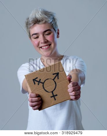 Good Looking Happy And Proud Trans Teenager Holding The Symbol Of The Transgender Drawn On A Cardboa