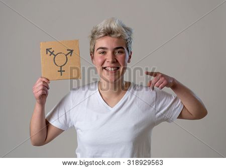 Good Looking Happy And Proud Trans Teenager Holding The Symbol Of The Transgender Drawn On A Cardboa