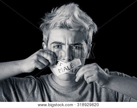 Transgender Teenager With Mouth Sealed On Tape With Words Male And Female Written In Social Taboo Of
