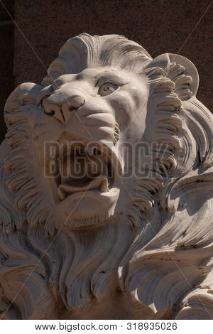 An Expressive Sculpture Of A Lion's Head Made Of White Stone. Close-up.