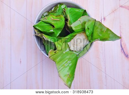 Sticky Rice (tape Ketan) With A Wooden Background, Sticky Rice Is A Traditional Food From Indonesia 
