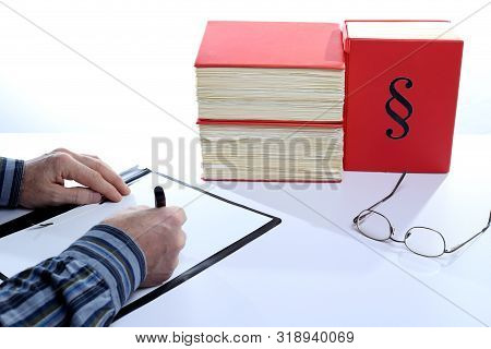 Business Man Is Filling In A Formular On Desk